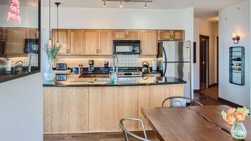Deluxe Condo | Private kitchen | Fridge, oven, stovetop, dishwasher