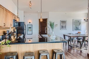 Deluxe Condo | Private kitchen | Fridge, oven, stovetop, dishwasher