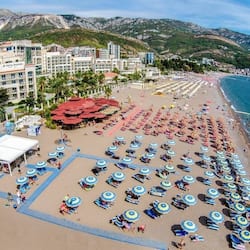 On the beach, beach shuttle, sun-loungers, beach umbrellas