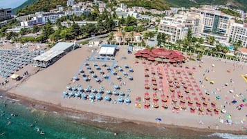 On the beach, beach shuttle, sun loungers, beach umbrellas
