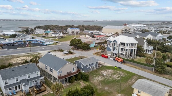 A coastal residential area with houses, a marina, and a road leading to a bridge. - The Saltbox-Home in Atlantic Beach (Atlantic Beach)