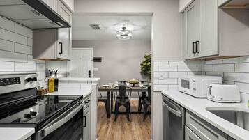 Fridge, coffee/tea maker, cookware/dishes/utensils