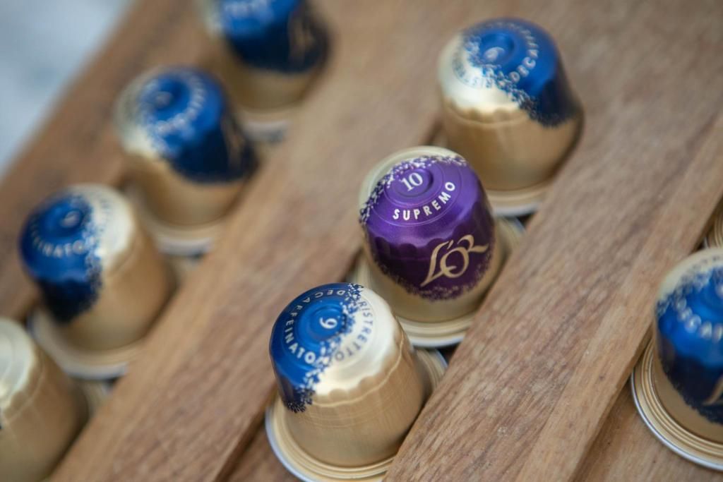 A close-up of several wine bottle caps, some with visible text and numbers.