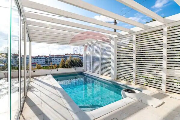 Outdoor pool, a rooftop pool, sun loungers