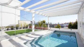 Outdoor pool, a rooftop pool, sun loungers