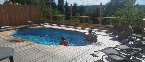 Outdoor pool, a heated pool, sun loungers