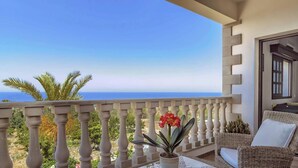A balcony with a view of the sea, a wicker chair, and a potted plant. - Away-from-it-all, Exceptional Sea Views Sleeps 10 (Ayia Marina Chrysochous)
