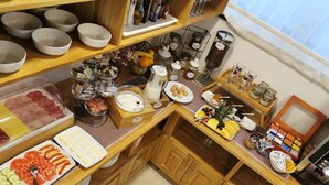 A kitchen with various food items and utensils.