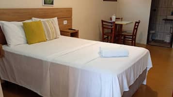 Standard Triple Room | Minibar, desk, laptop workspace, blackout drapes