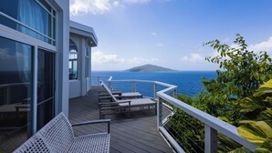 A deck with lounge chairs and a railing overlooking the ocean. - Unrivaled Oceanfront Views In Our Private Caribbean Resort (St Thomas)