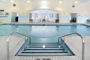 Swimmers can enjoy a safe and clear view of the pool's edge, marked with depth indicators.