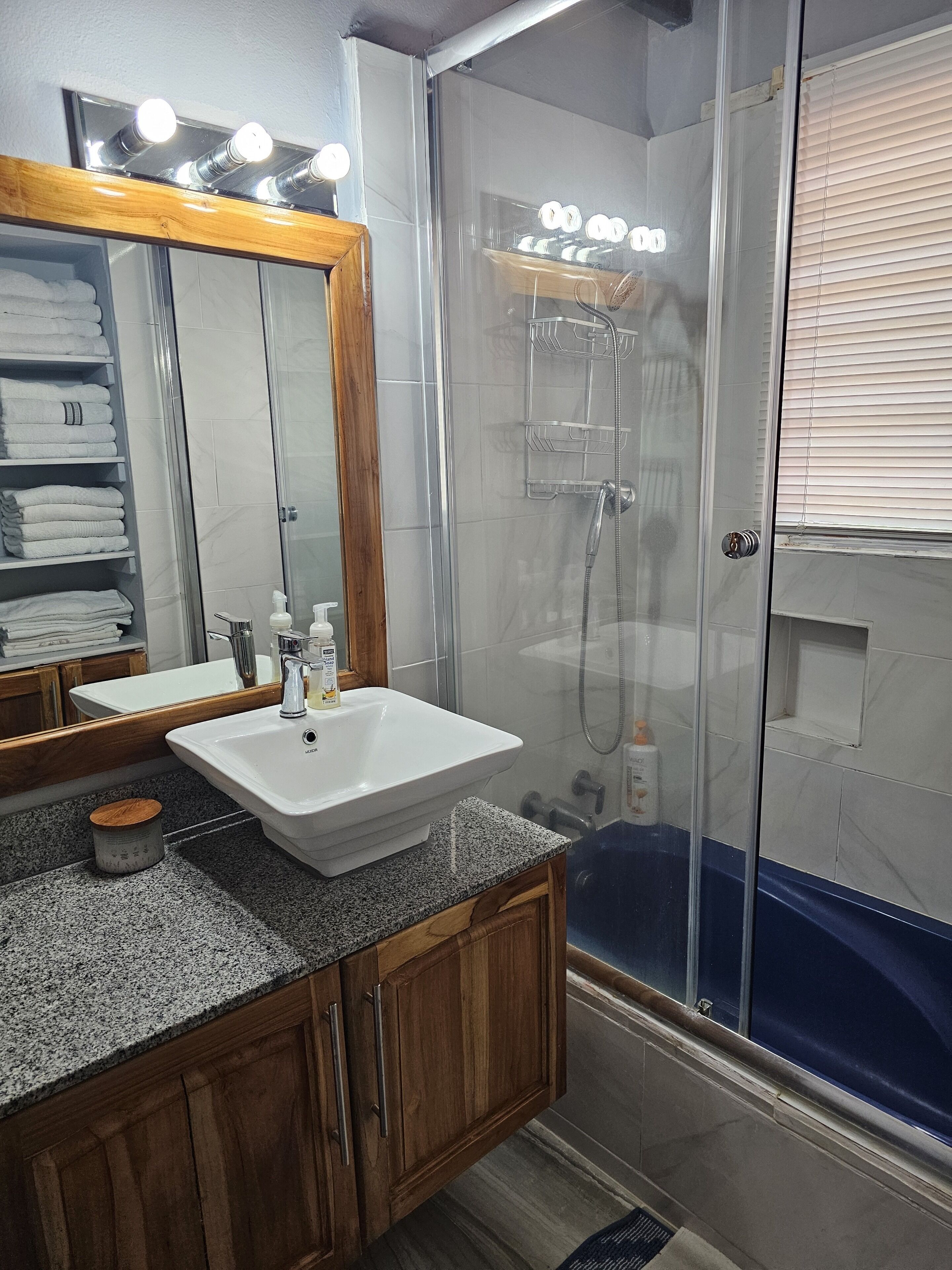 Shower, towels, soap, toilet paper