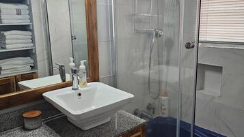 Shower, towels, soap, toilet paper