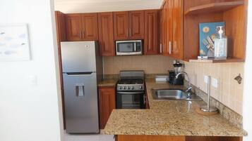 Family Apartment, 2 Bedrooms, Balcony, Pool View | Private kitchen | Full-size fridge, microwave, coffee/tea maker, toaster