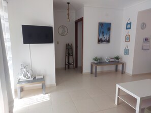 Family Apartment, 2 Bedrooms, Balcony, Pool View | Living area | 32-inch TV with digital channels - Caribbean Life II (Punta Cana)