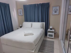 Grand Apartment, 2 Bedrooms, 2 Bathrooms, Garden View | 2 bedrooms, blackout drapes, iron/ironing board, free WiFi