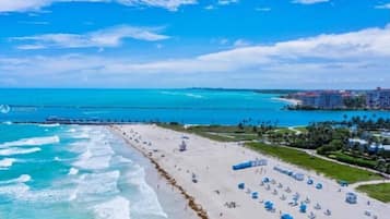 On the beach, sun loungers, beach towels