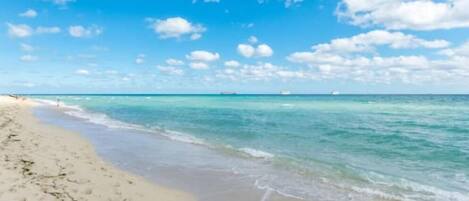 On the beach, sun-loungers, beach towels