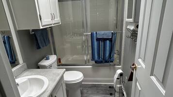 Shower, hair dryer, towels, soap