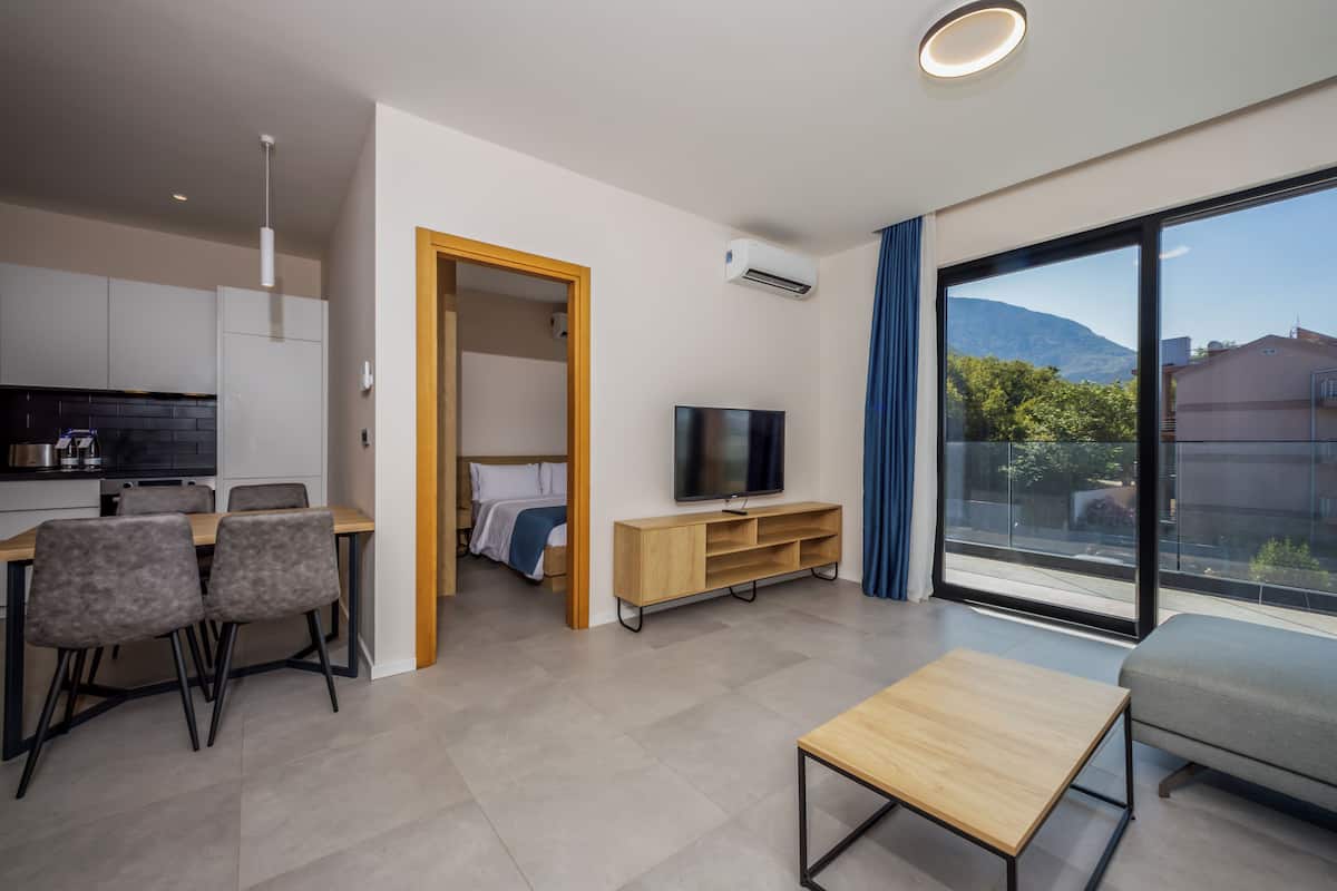 Superior Apartment, 1 Bedroom, Balcony, Garden View | Living area | 42-inch LED TV with satellite channels