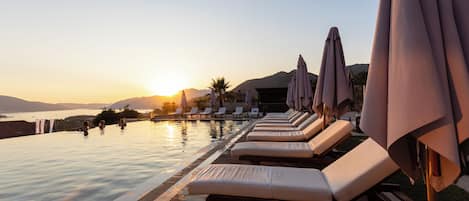 Outdoor pool, open 8:00 AM to 7:00 PM, pool umbrellas, sun loungers