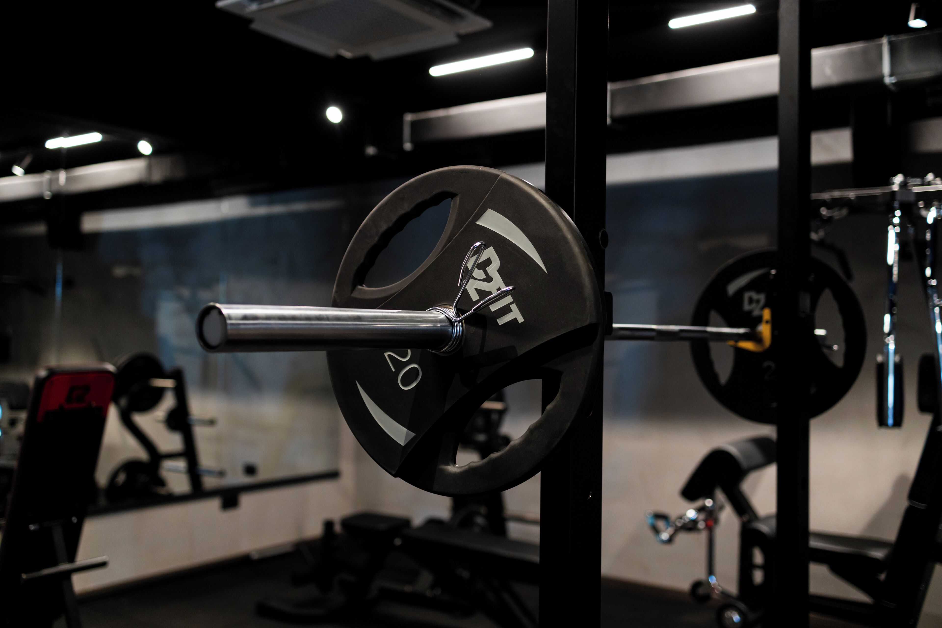A weightlifting area with barbells and weight plates.
