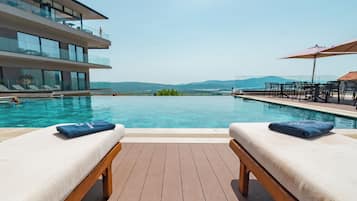 Outdoor pool, open 8:00 AM to 7:00 PM, pool umbrellas, sun loungers