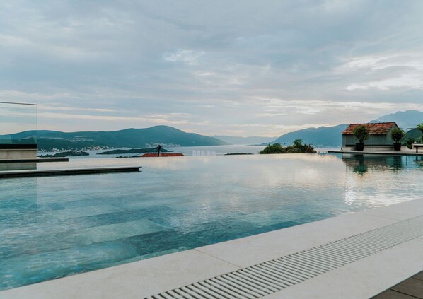 Outdoor pool, open 8:00 AM to 7:00 PM, pool umbrellas, sun loungers