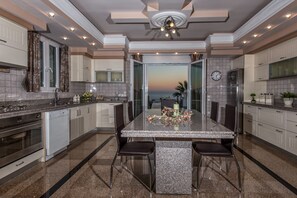 Villa, 5 Bedrooms, Balcony, Garden View | Private kitchen | Coffee/tea maker, dining tables