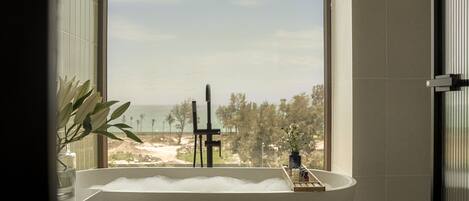 Suite | Bathroom | Separate bathtub and shower, bathrobes, slippers, towels