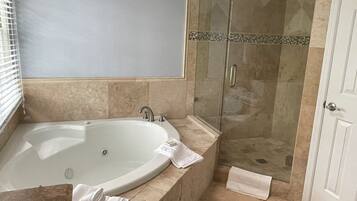 Shower, jetted tub, hair dryer, towels