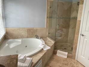 Shower, jetted tub, hair dryer, towels