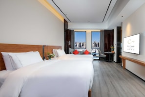 Habitació amb dos llits individuals Deluxe | Cobrellits, matalassos amb encoixinament addicional i minibar gratuït