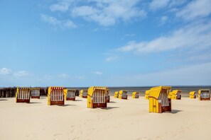 Beach huts with a view of the sea.