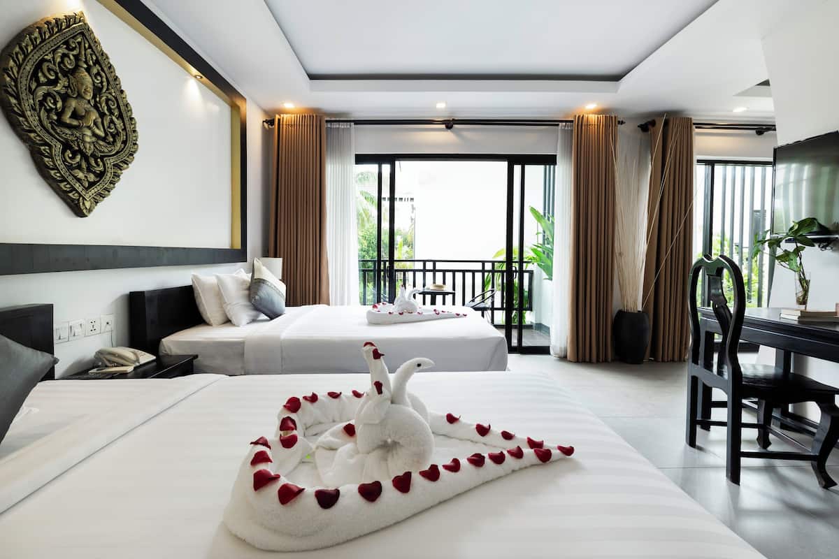 Family Triple Room | Premium bedding, minibar, in-room safe, individually decorated
