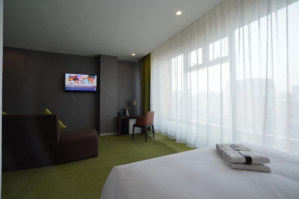 Family Suite, 1 Bedroom, Non Smoking, City View | 1 bedroom, down comforters, minibar, individually decorated