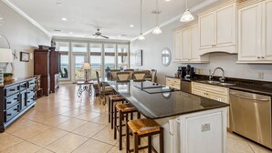 A spacious kitchen with a large island, modern appliances, and ample counter space.