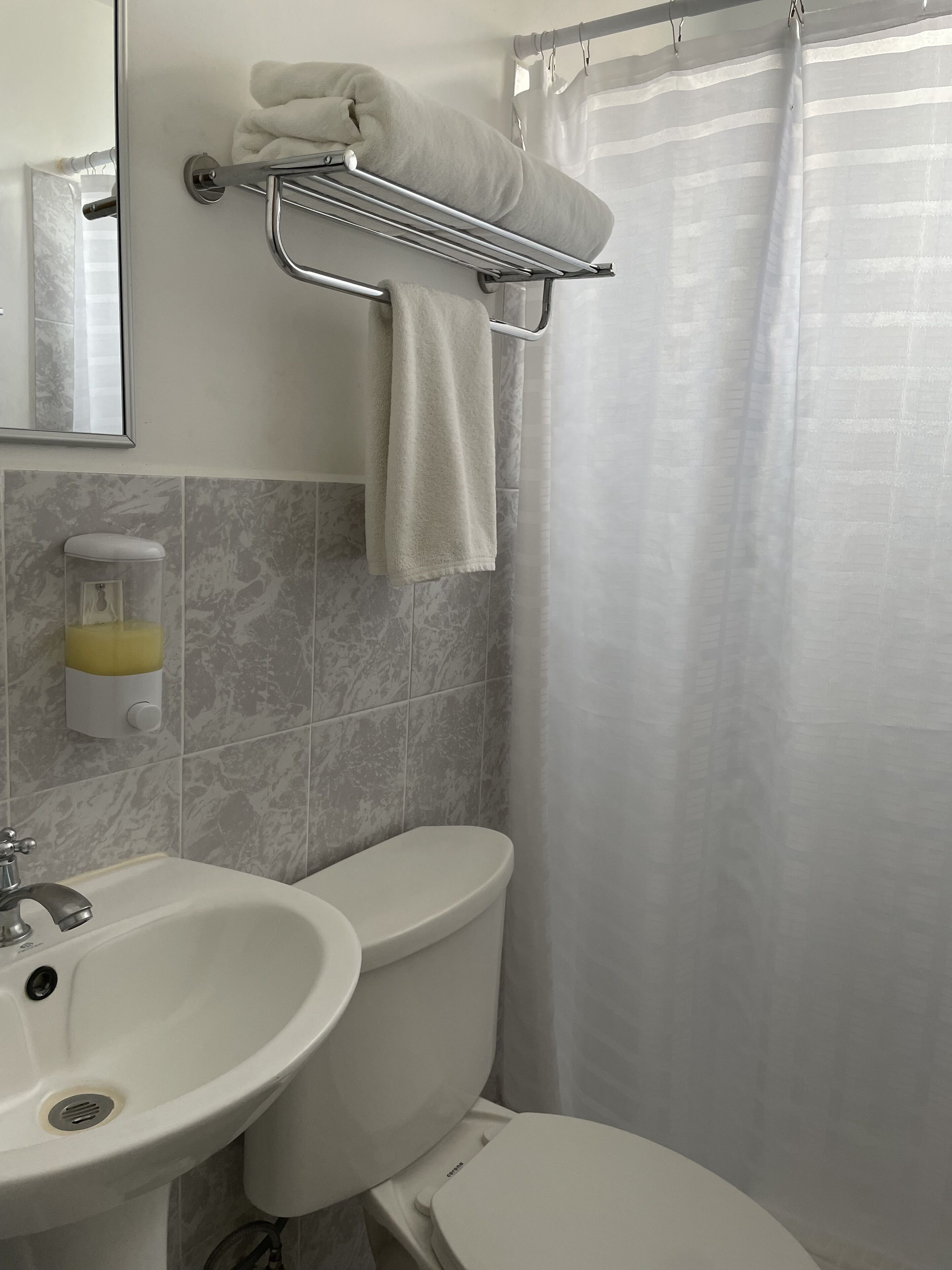 economy room | bathroom | shower, hair dryer, towels, soap