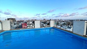 A rooftop pool with a city view, surrounded by buildings. - Dune View Hotel (Mombasa)