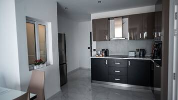 Apartamento superluxo | Área de estar | TV LED 42 polegadas com canais digitais, TV