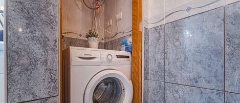 Bathtub, hair dryer, towels