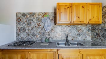 Fridge, microwave, stovetop, cookware/dishes/utensils