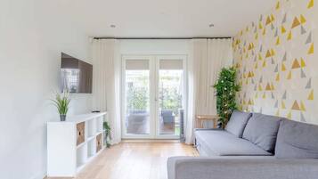 Basic House, Multiple Beds | Living area | TV