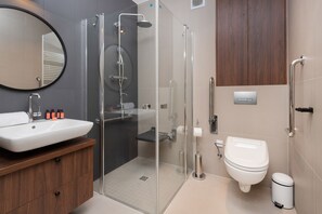 Shower, hair dryer, towels, shampoo