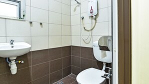 A bathroom with a sink, toilet, and shower. - SPOT ON 91723 Sony Homestay Syariah (Sukabumi)