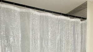 A shower curtain with a speckled pattern. - Centrally located, Cozy two bedroom basement apartment, 10 mins from YYC airport (Calgary)
