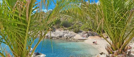 On the beach, sun-loungers