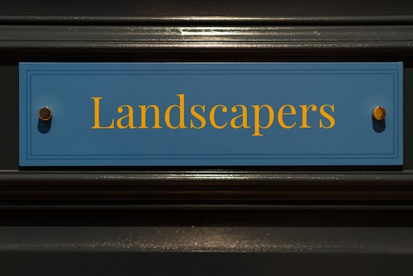 A blue sign with the word "Landscapers" in gold lettering. - The Ironmongers Boutique (Norwich)