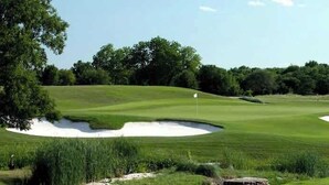 A golf course with sand bunkers and a flagstick. - Apt 335 · Luxury 2Bd Queen Unit | Free Parking |Hwy121| TPC (McKinney)