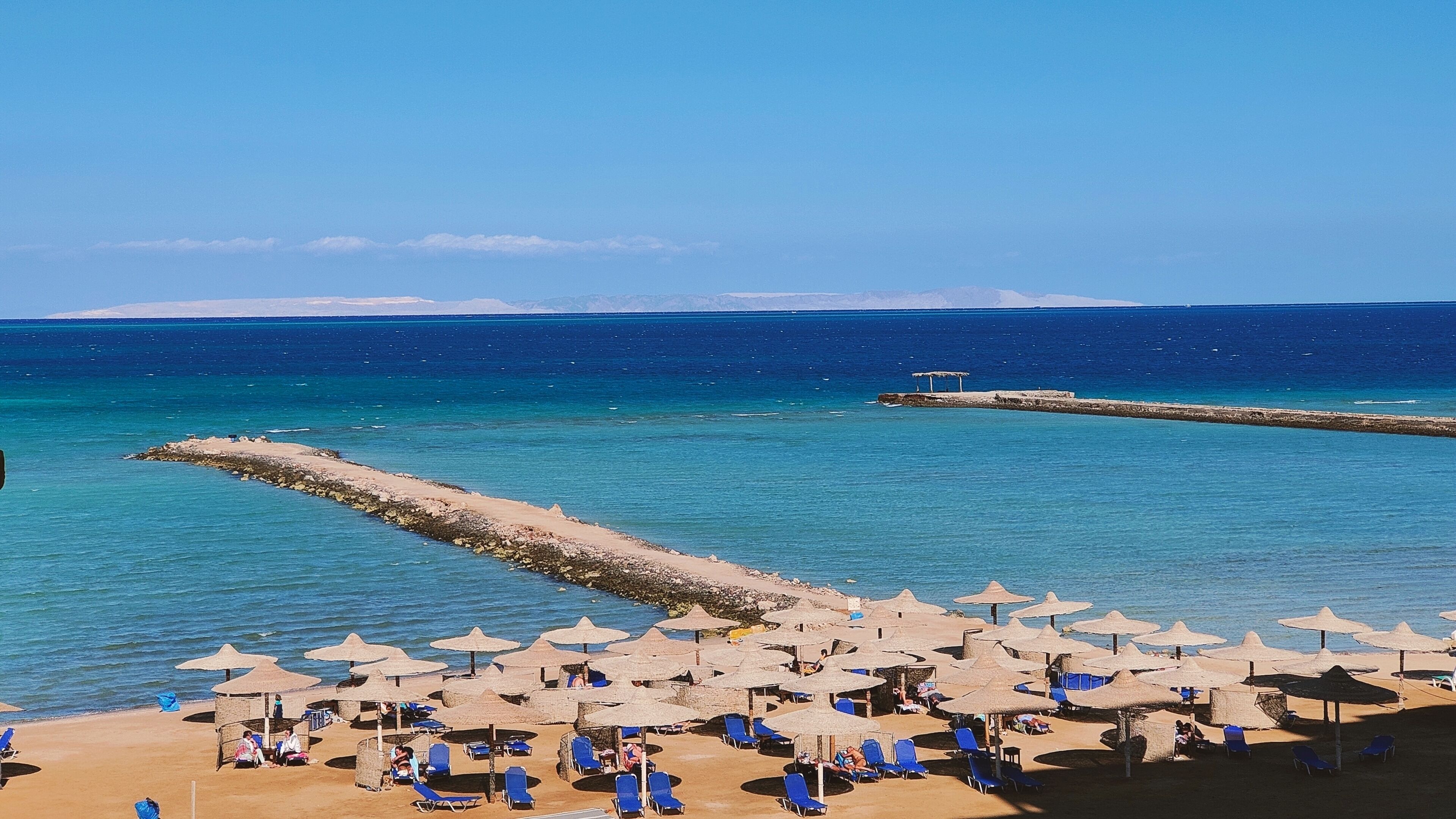 On the beach, sun-loungers, beach towels